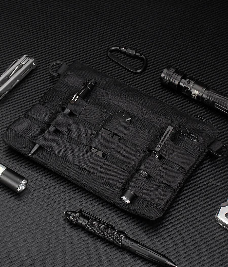 Black Oxford cloth military kit bag showing compact 18cm by 3.5cm size.
