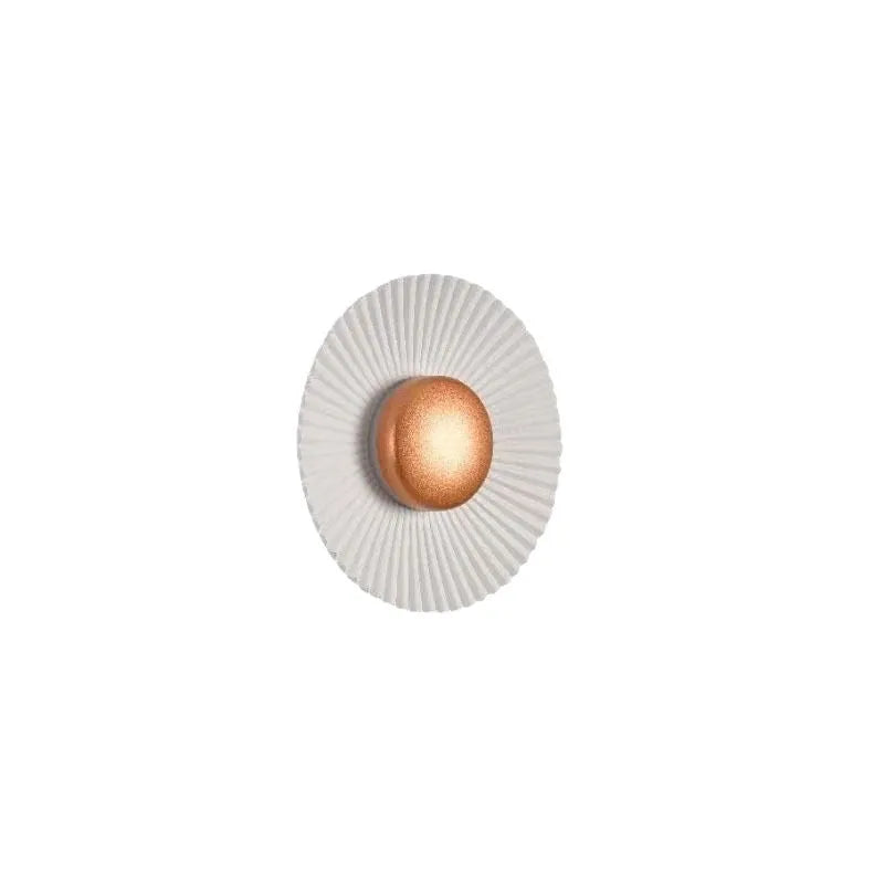 Round aluminium wall lamp with white and gold colour options mounted on wall