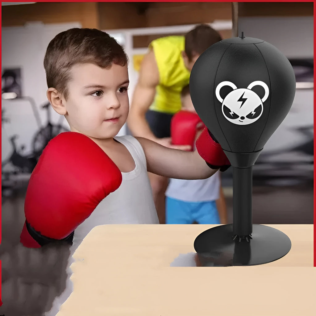 Tabletop boxing speed ball with suction cup base and PU leather inflatable sphere on a desk.