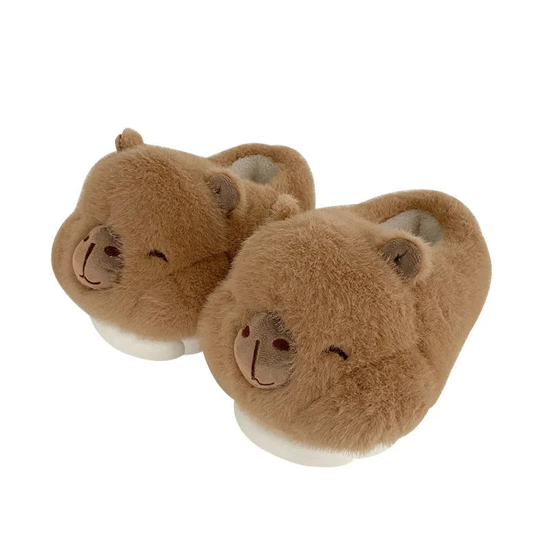 Light brown women's winter plush slippers with a cartoon pattern and artificial wool lining.