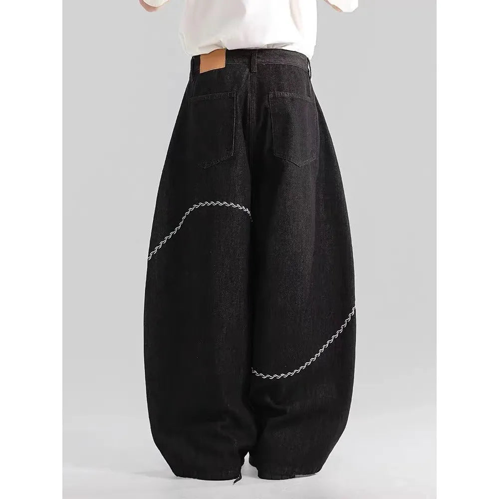 Black straight-leg denim trousers with mid waist and zip fly on mannequin