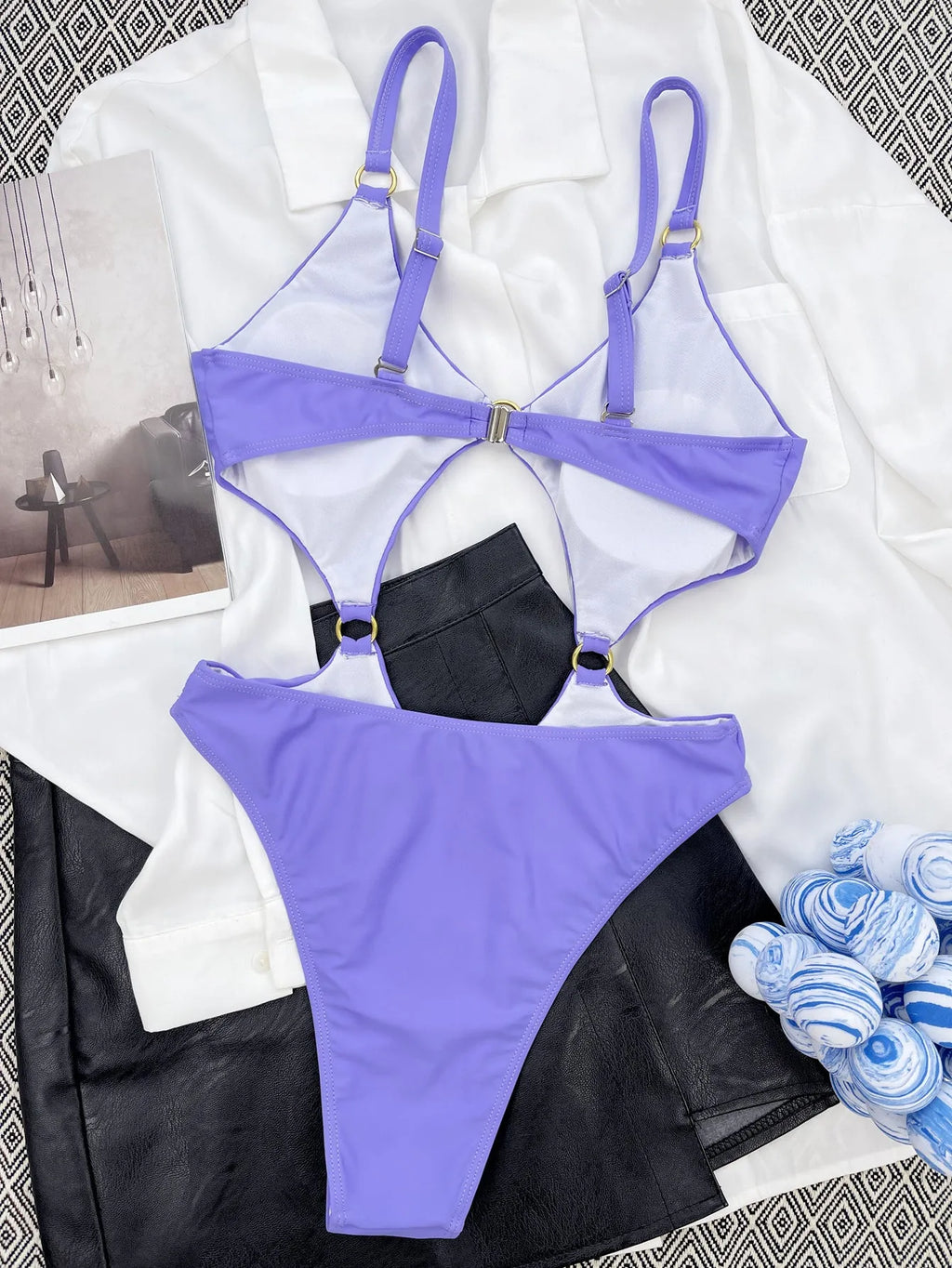 Purple one-piece swimsuit made from nylon with 80% fabric content, available in S, M, L sizes