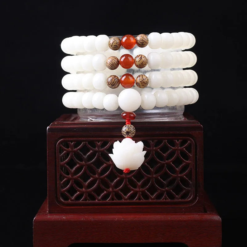 White jade Bodhi bead bracelet with 6x8mm beads in various decorative styles