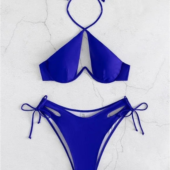 Women's solid colour halter bikini swimsuit with backless briefs in black, blue, or brown.