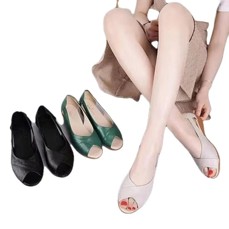 Women's black peep toe sandals with a mid heel and ankle buckle strap on a rubber sole.