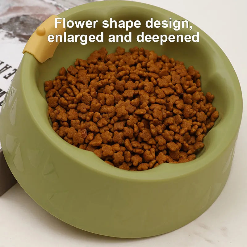 Green plastic flower-shaped double pet bowl for food and water on a white background.