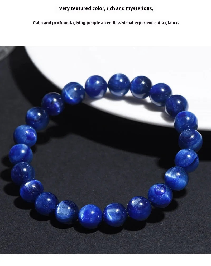 Natural blue crystal geometry ball bracelet with Ruyi charm on a white background.