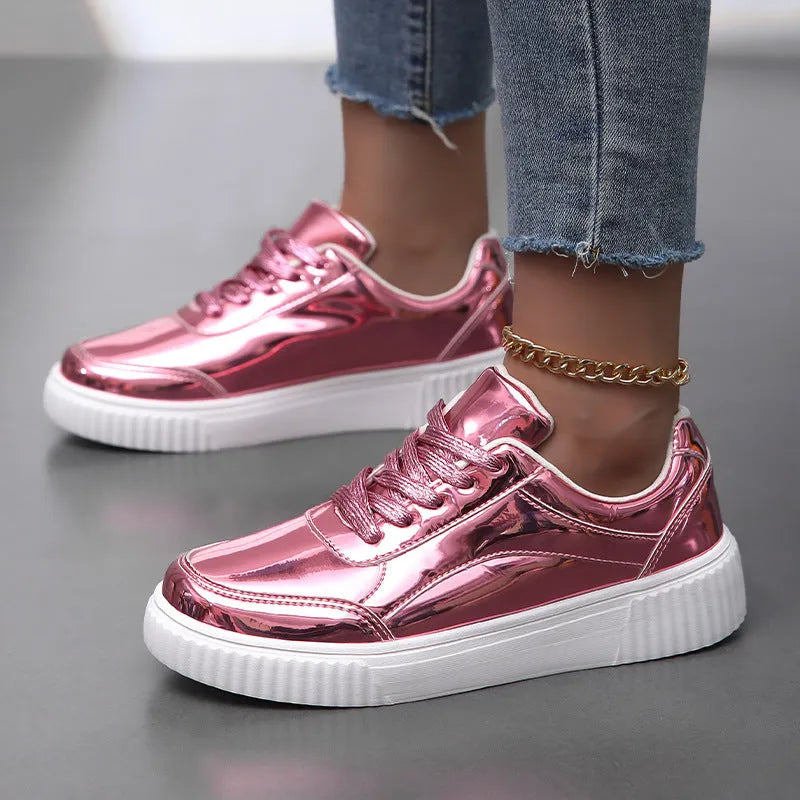 Gold platform sneaker with sequin upper and thick MD sole on a white background.