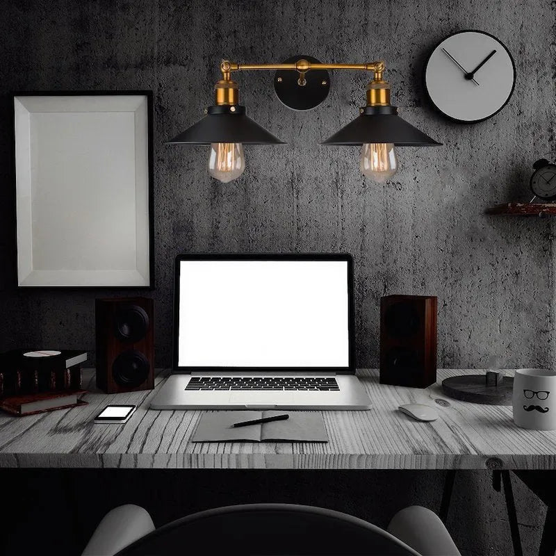 Black iron industrial-style wall lamp with two adjustable heads in a retro design