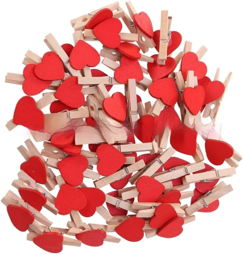 Five small handmade solid wood heart-shaped clips in red, rose red, and white colours.