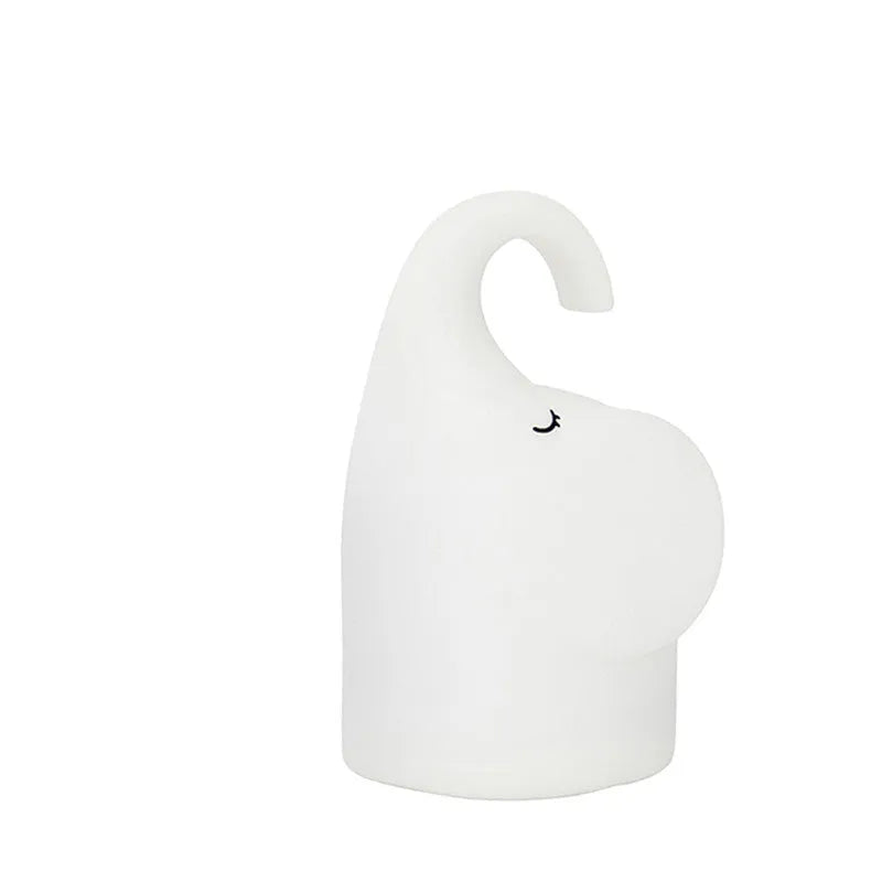 DOMI Elephant silicone night light with soft white LED glow on bedside table