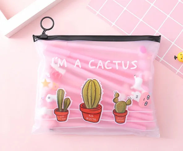 Open plastic case showing twenty 0.5mm black gel pens with cartoon cactus designs for boys and girls.