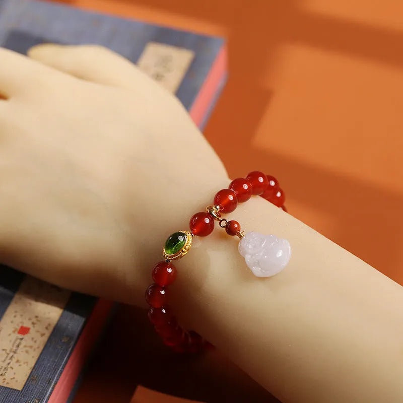 Handmade red agate bracelet with geometric Chinese design featuring Maitreya Buddha jade pendant and ancient gold elements
