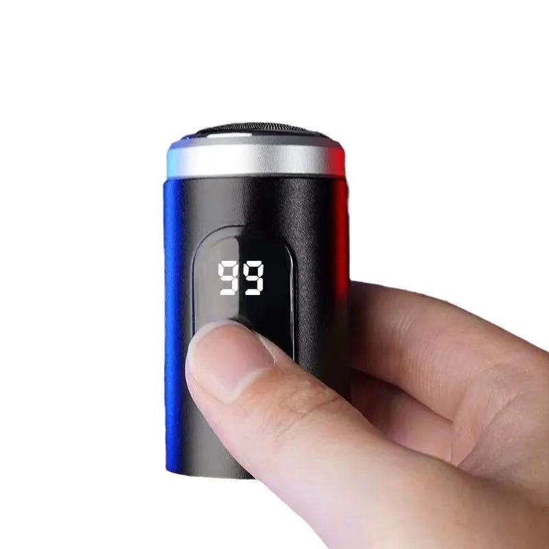 Black mini USB rechargeable shaver with cleaning brush and cable on white background