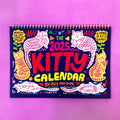 Cat-themed wall calendar for the 2024 or 2025 year on a single paper sheet.