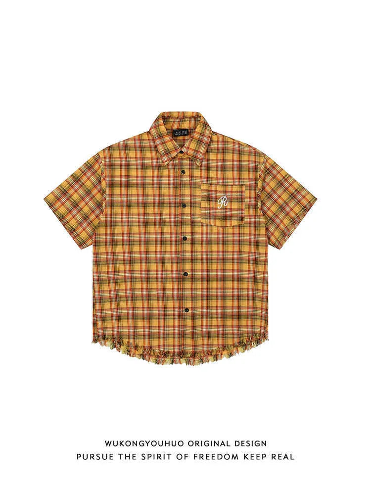 Yellow and white check short sleeve shirt with an embroidered chest pocket on a loose fit.