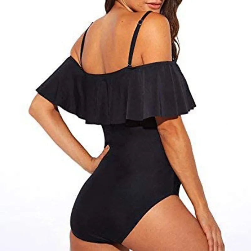 Black one-piece swimsuit with cut-out tube top and ruffled straps on a mannequin