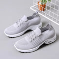 Women's black casual sneaker with mesh upper, lace-up front, and soft PVC sole.