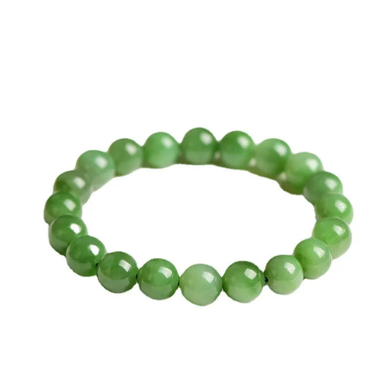 Natural Hetian jade beaded bracelet in various bead sizes on a plain background.