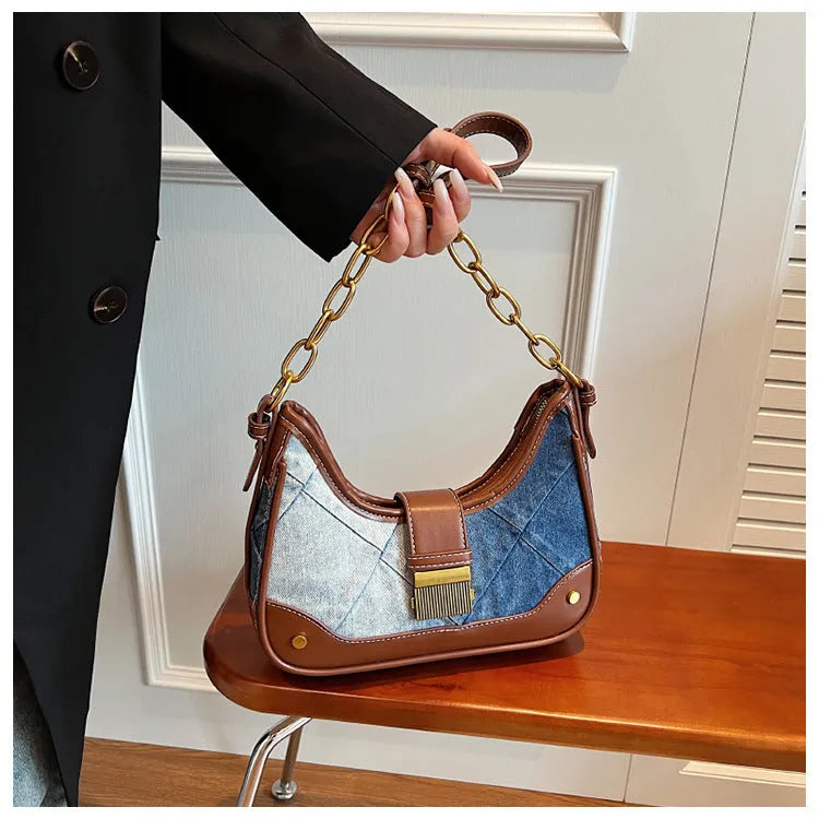Brown denim women's bucket shoulder bag with chain strap and diamond mesh detail.