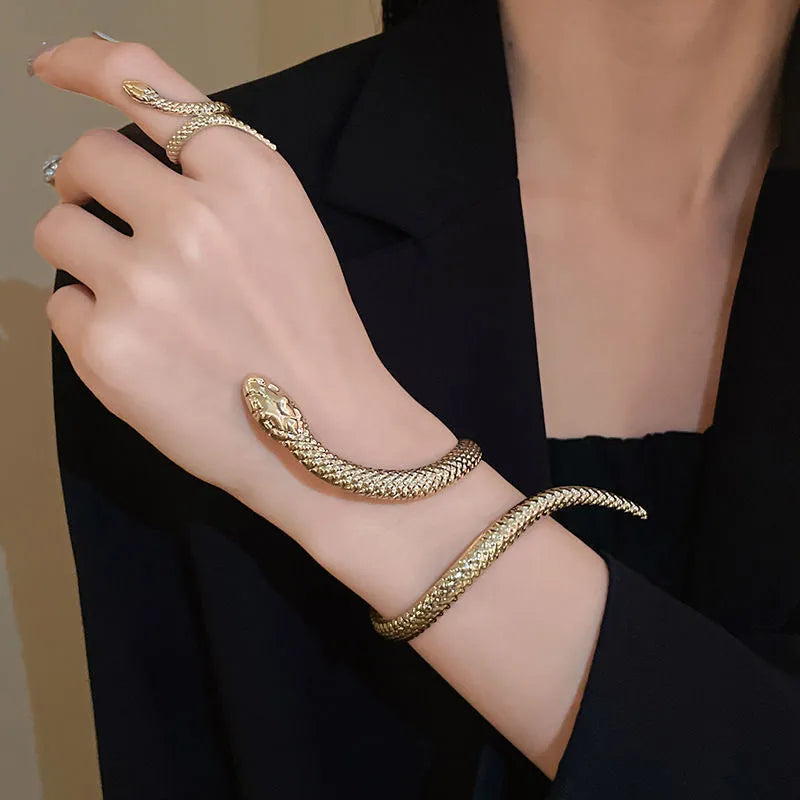 Gold and silver tone snake motif ring and bracelet set with twisted winding design