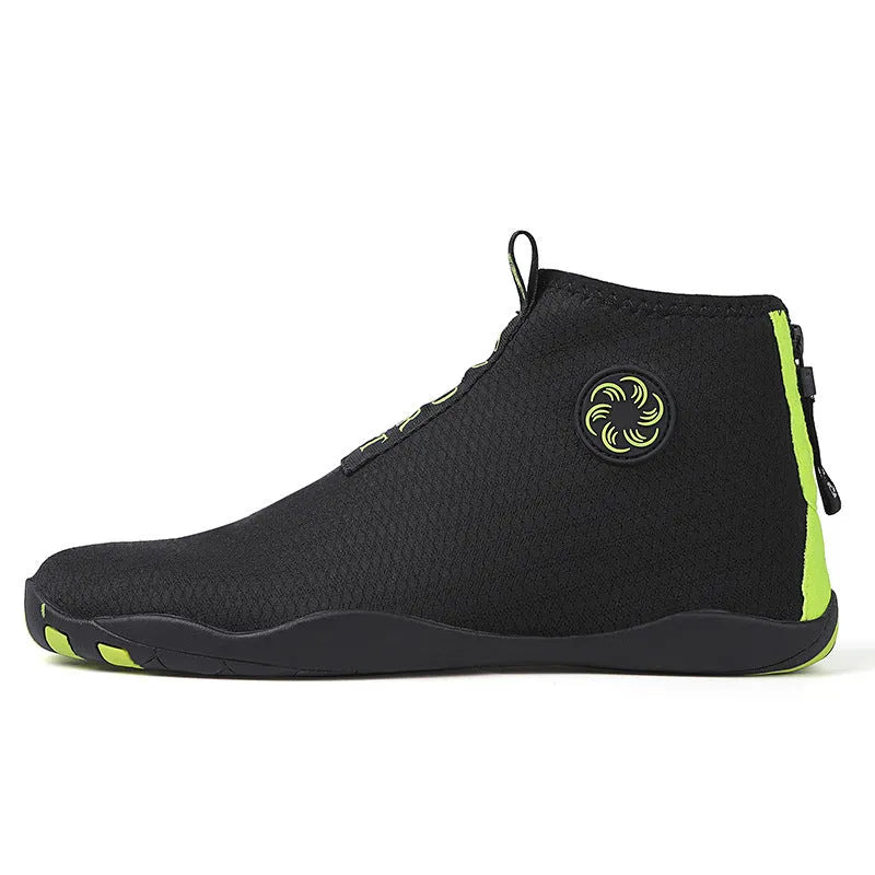Men's black and fluorescent green quick-dry mesh beach shoes with a non-slip rubber sole on a rocky surface.