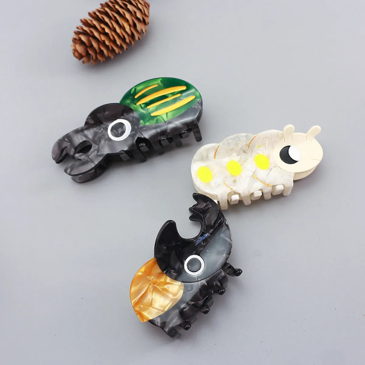 Handmade cellulose acetate beetle grip hair accessory with insect biology design