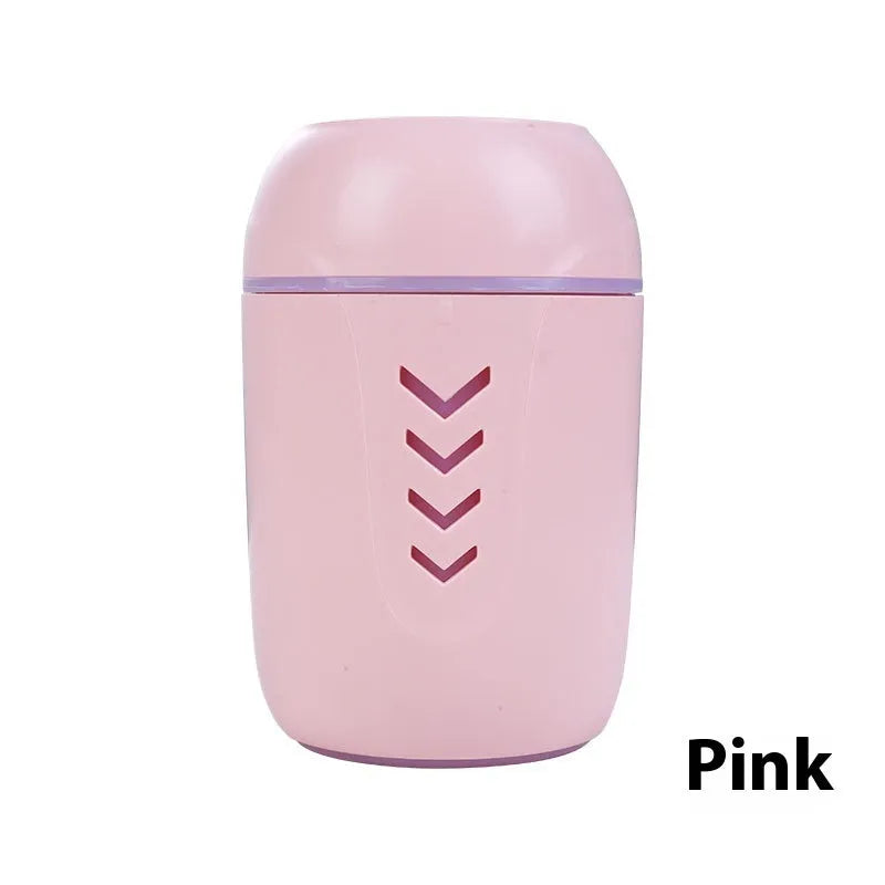 Compact round USB portable air purifier in blue, pink, or white for car and desktop use.