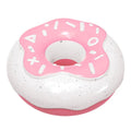 Pink donut-shaped squeaky dog toy with textured surface for dental cleaning