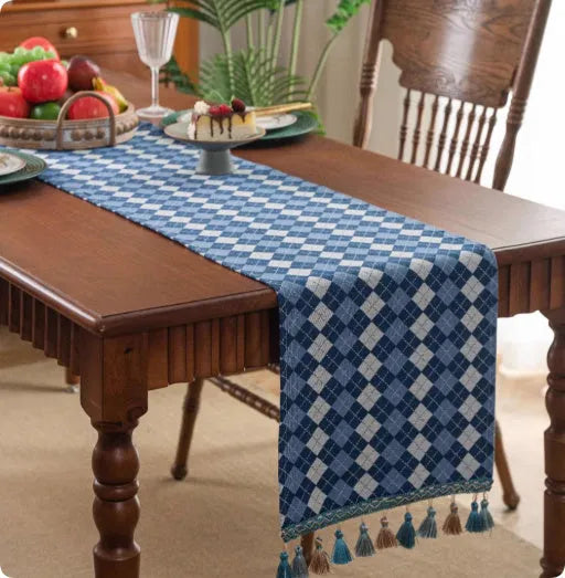 European retro cotton linen style table flag with handwoven tassels in blue ginkgo leaves pattern on sideboard