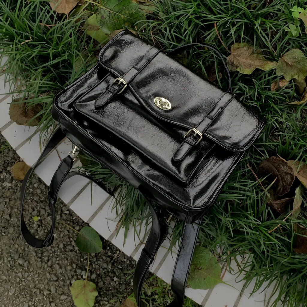 Black college messenger bag with oil wax leather finish for university students
