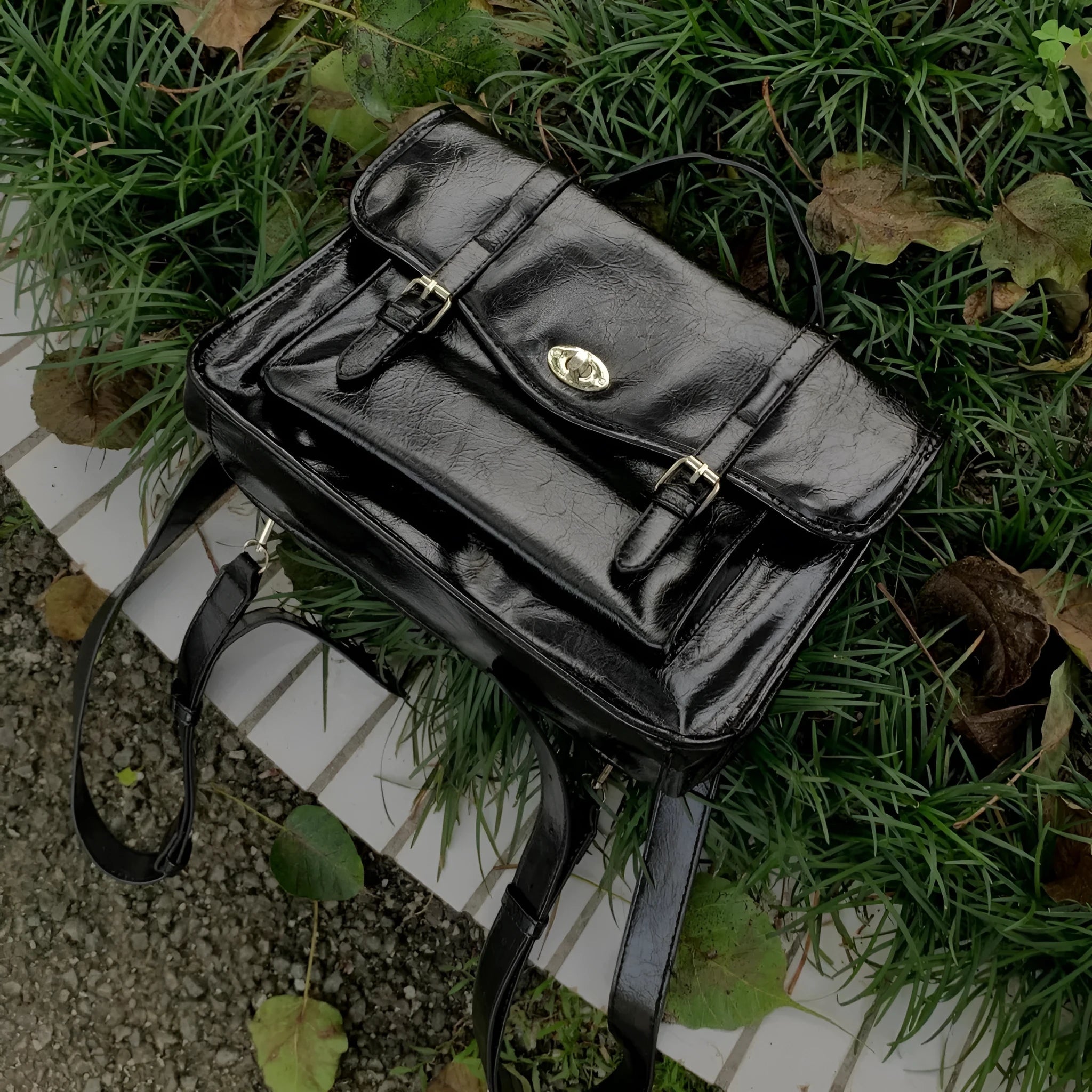 Black college messenger bag with oil wax leather finish for university students