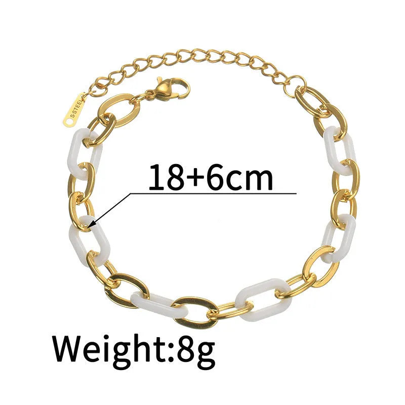 Women's stainless steel bracelet with electroplated finish and a double-layered resin heart charm.