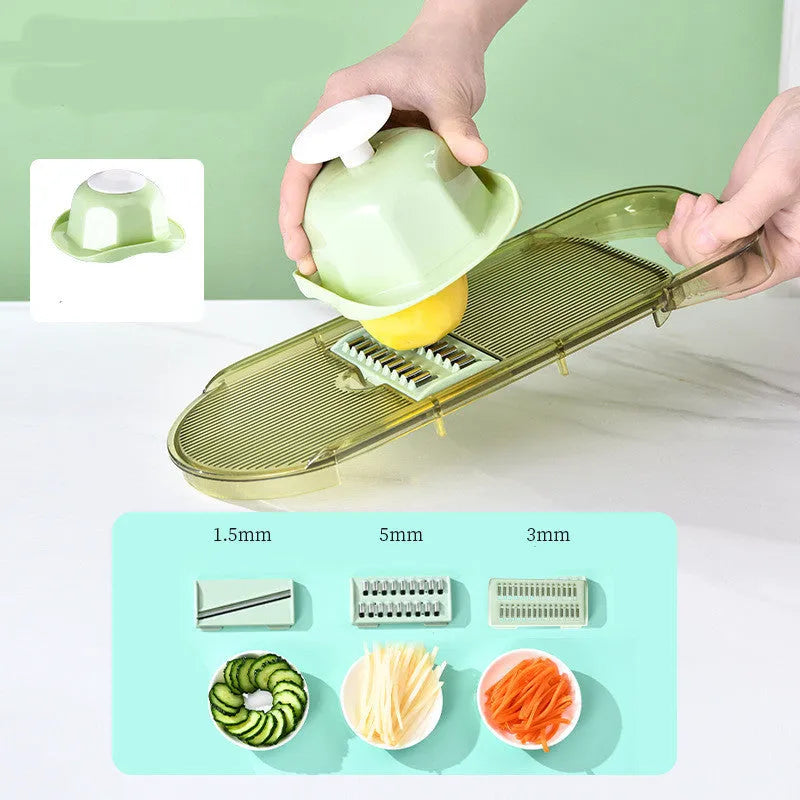 Transparent green vegetable cutter with stainless steel blades and 1.5L chopping box