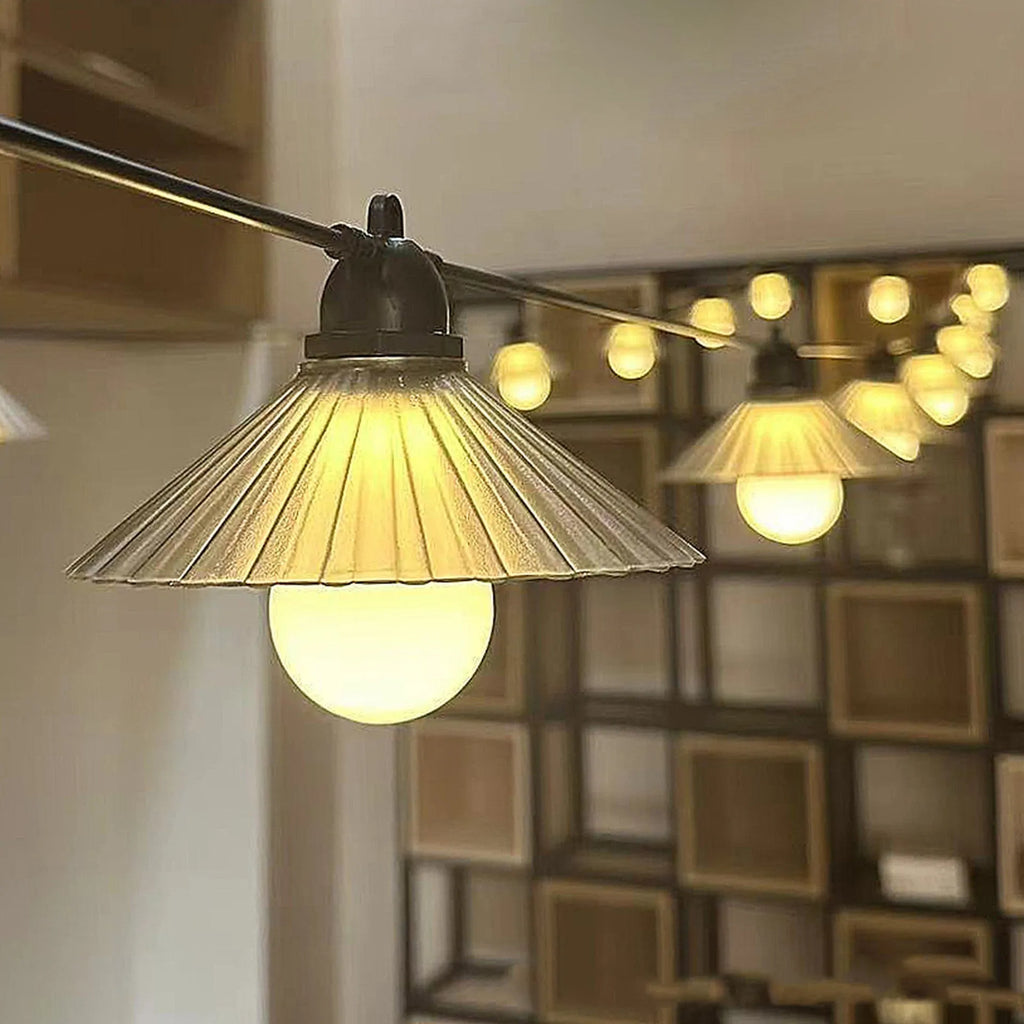 Outdoor LED string lights with flower-shaped globes shown in warm white and multi-colour settings.