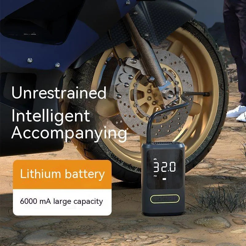 Handheld wireless digital display car air pump with LED light, hose, and multiple nozzles on black background