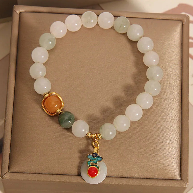 Ice jade bracelet for women with pearl charm and jade buckle in Chinese retro style.