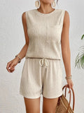 Women's apricot sleeveless round neck vest and matching shorts set on a hanger.