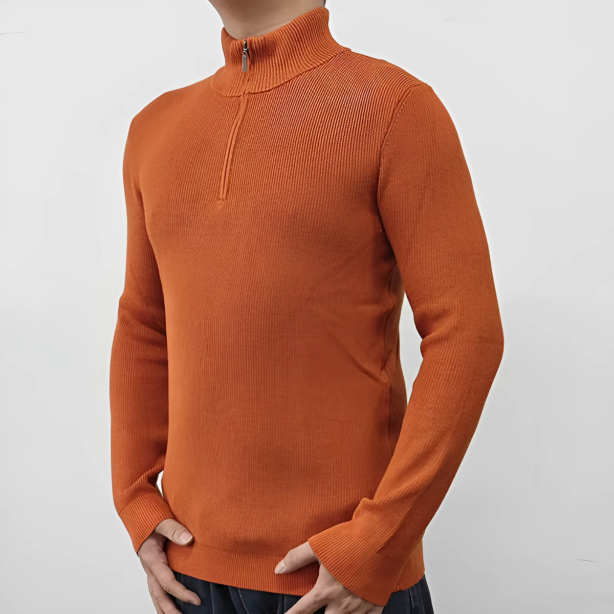 Men's grey half-turtleneck zip-up sweater on a hanger, showing front zip and long sleeves.