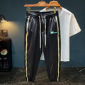 Men's solid colour cotton ice silk harem pants in black or grey with loose fit and trousers length