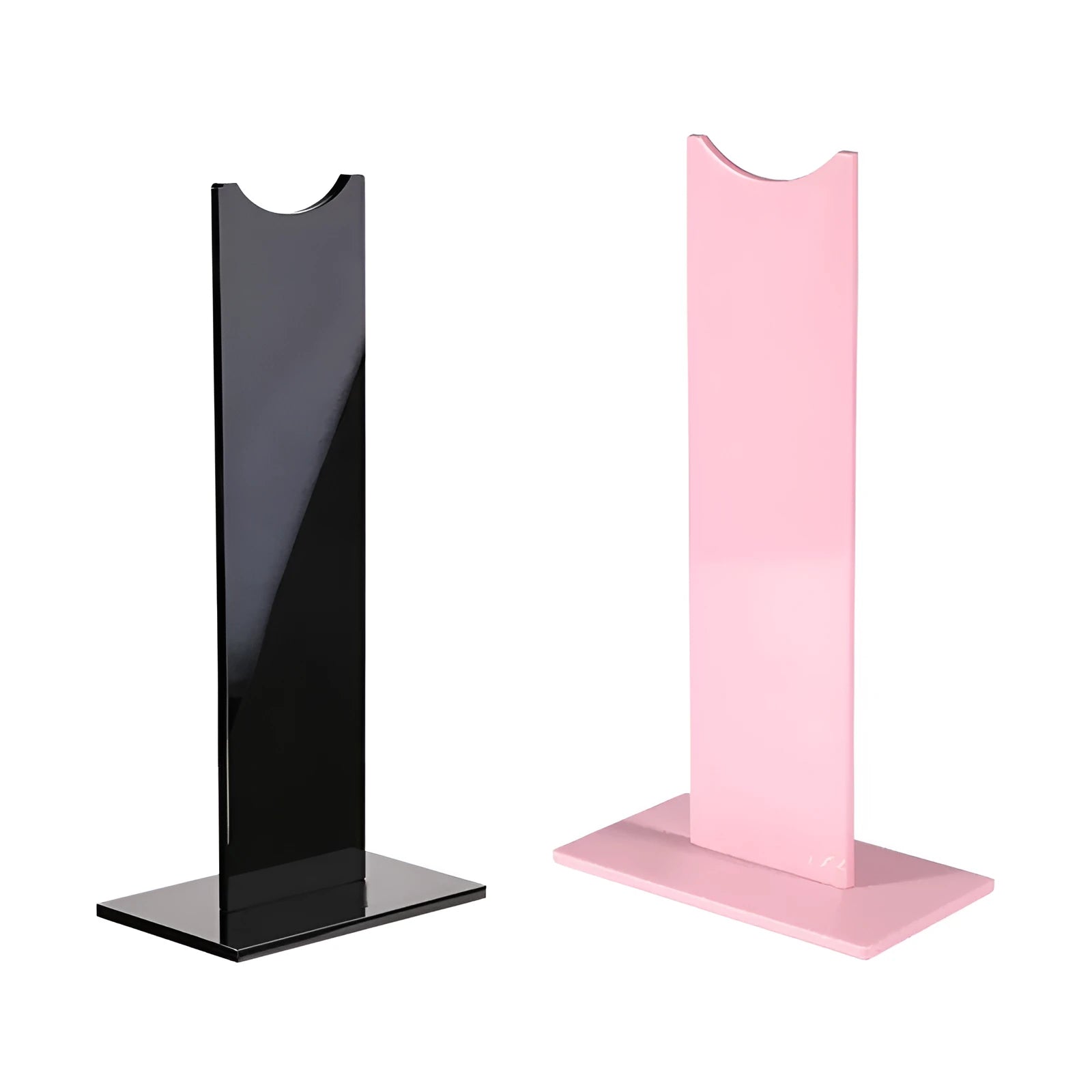 Pink and black detachable headphone stand with silicone base on a desk.
