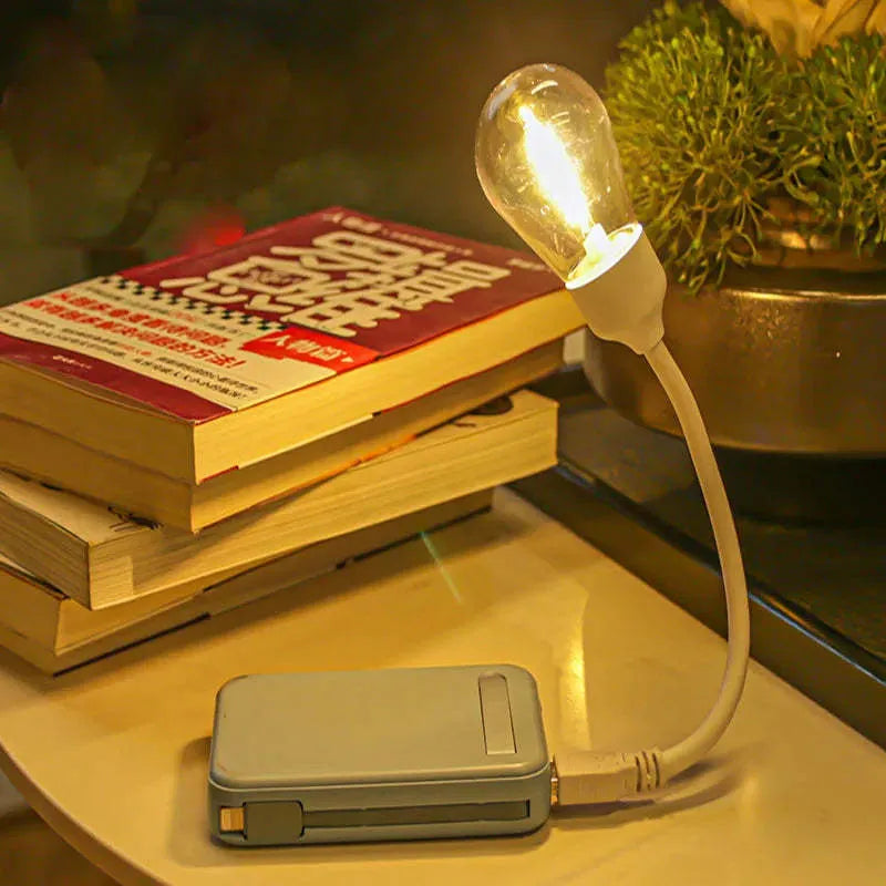 USB rechargeable folding night light with glowing tungsten S14 filament bulb