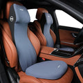 Black automotive memory foam seat cushion with integrated lumbar support headrest pillow.