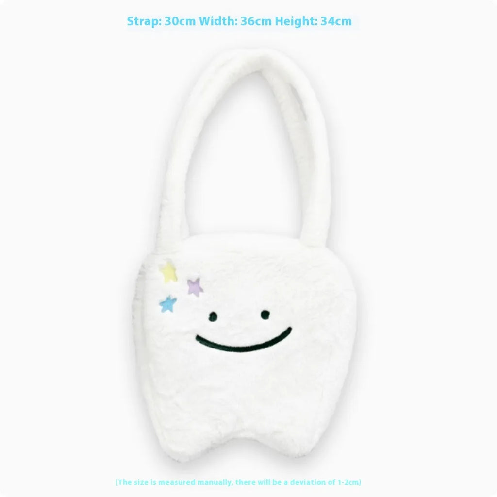 White plush tote bag with a cute teeth pattern, showing the shoulder strap and zipper closure