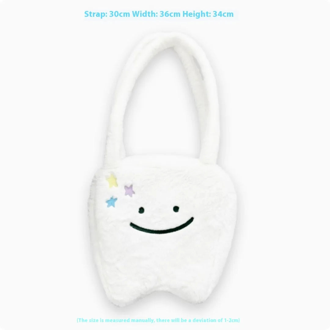 White plush tote bag with a cute teeth pattern, showing the shoulder strap and zipper closure