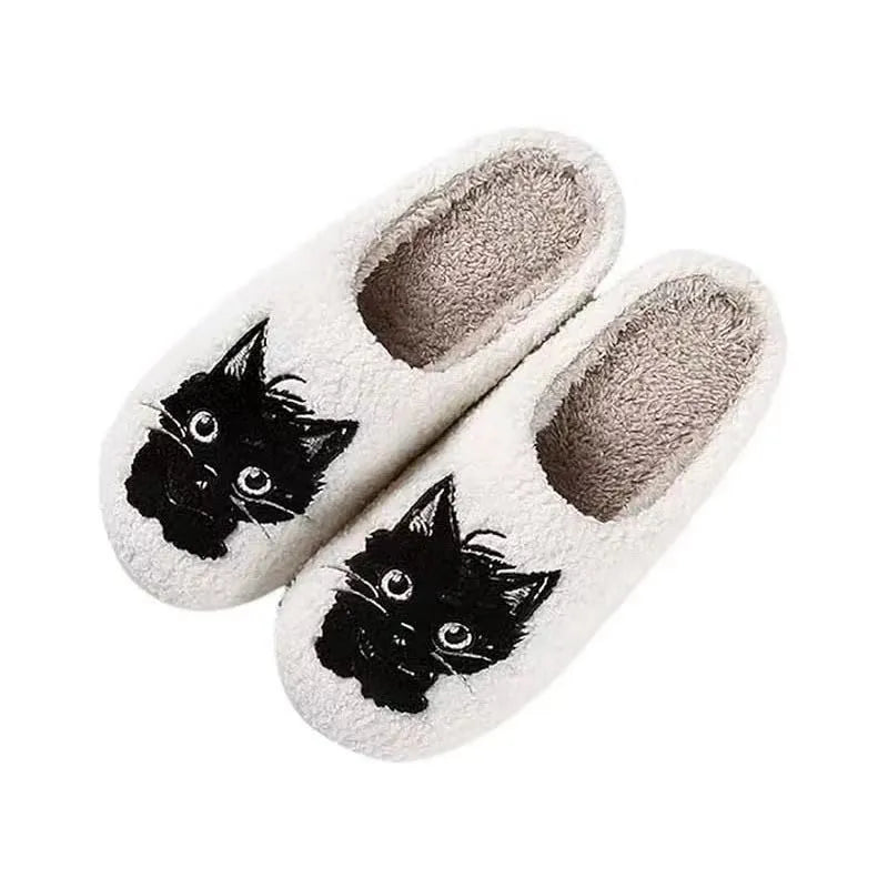 White plush cat cartoon patterned slippers with a non-slip sole.