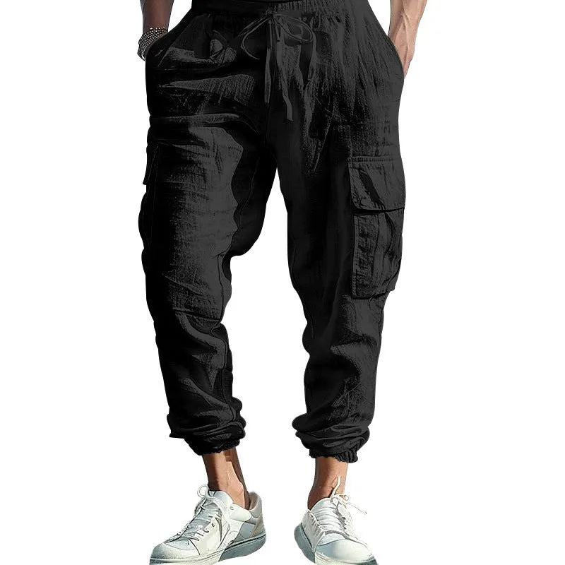 Men's loose fit linen trousers with ankle-tied hem and multiple pockets in army green.