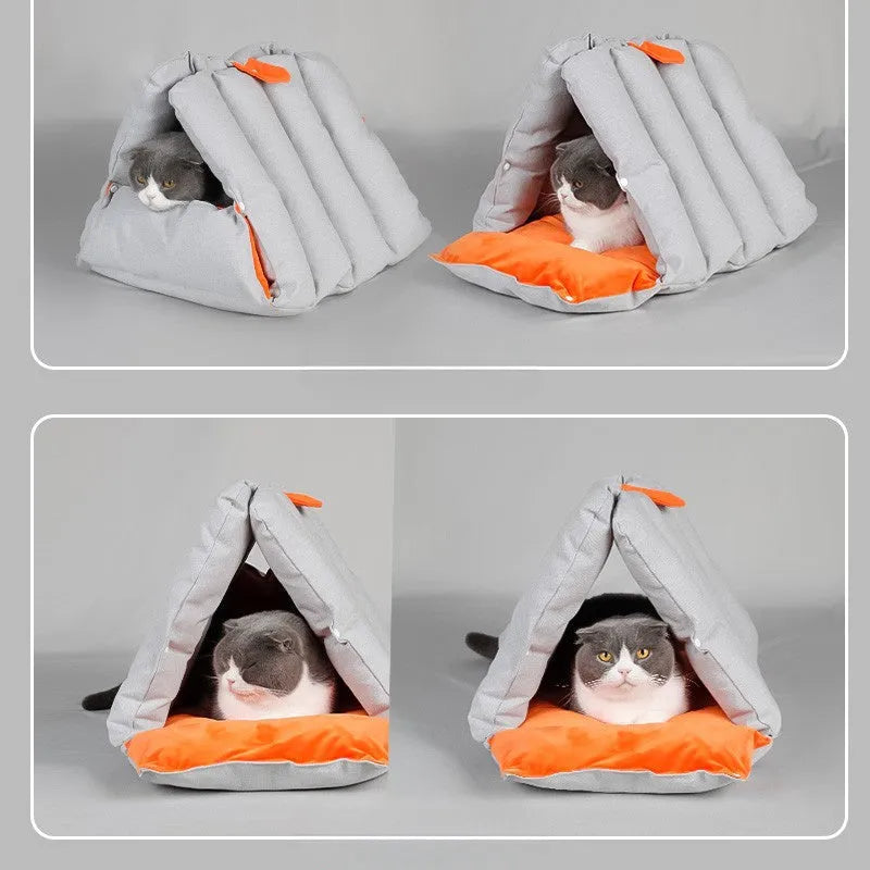 Blue triangular cat bed with drilled holes on a sofa, showing removable cotton cover.