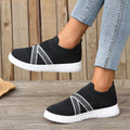 Black women's flyknit mesh casual shoes with flat rubber sole and round toe.