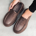 Men's black waterproof platform slip-on shoes with artificial leather upper and mid-heel design